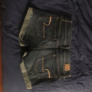 AE Brand new Jean shorts with leather side trim.